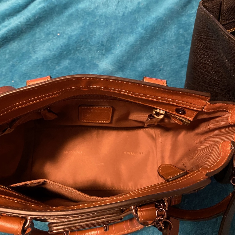 Two coach purses and a handmade leather purse and matching wallet